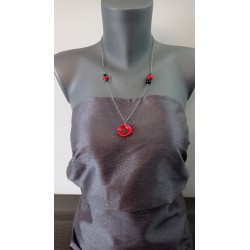 Red and black earthenware jumper on anallergic stainless steel