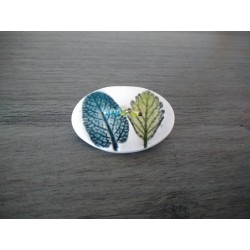 Broche rouge et blanche en faïence artisanale sur cuir et acier inoxydable made in france vendée