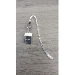Grey, black ceramic and silver metal page mark