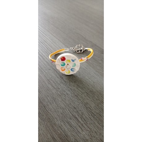 Colorful homemade earthenware bracelet on blue leather and stainless steel made in france vendée