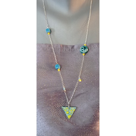 Turquoise blue, green and yellow leaf earthenware jumper on anallergic stainless steel